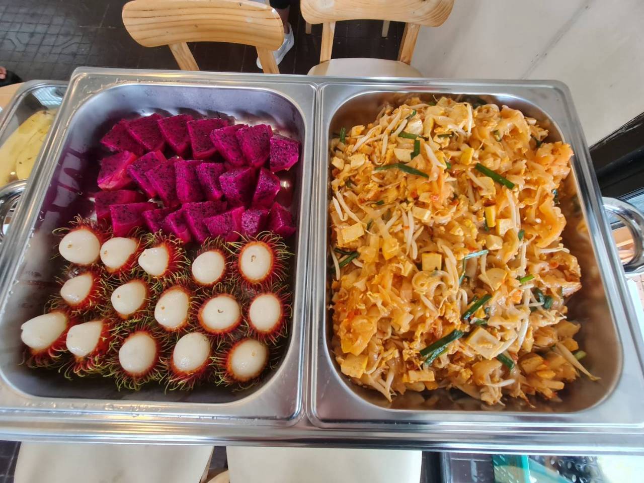 Thai lunch buffet with pad thai, dragon fruit and rambutan