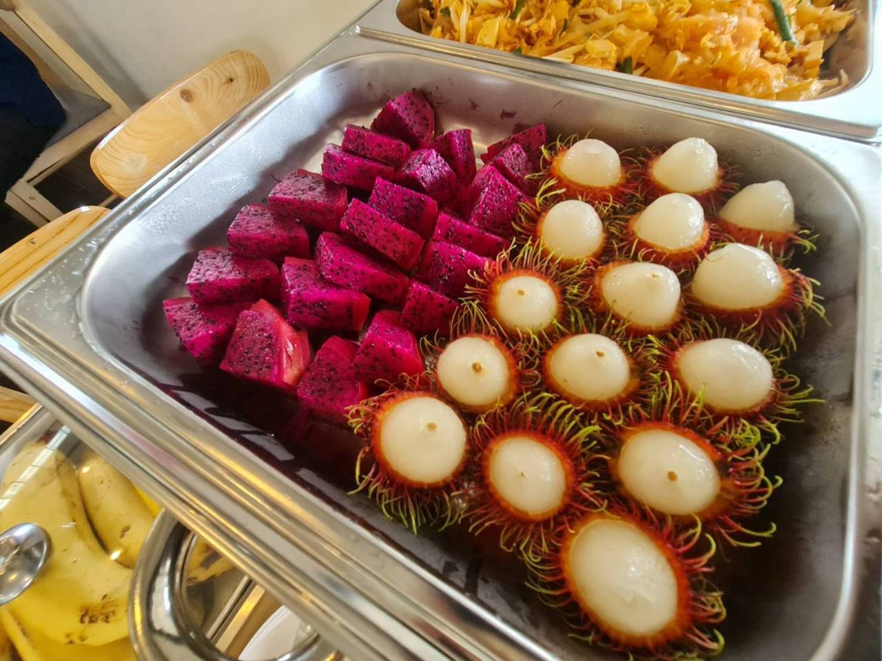 Fresh dragon fruit and rambutan served with lunch